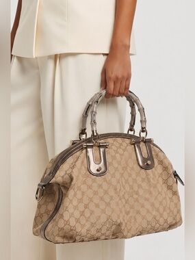 Gucci Authentic Pre Owned Bamboo Handle GG Canvas Bag with Metallic Accent.